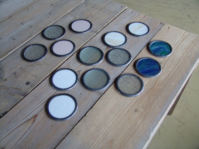 Onderzetters diverse kleuren, ca. 9cm ⌀, € 4,- per stuk